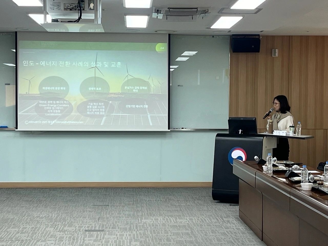 Delivering a lecture on global energy market and policy trends.